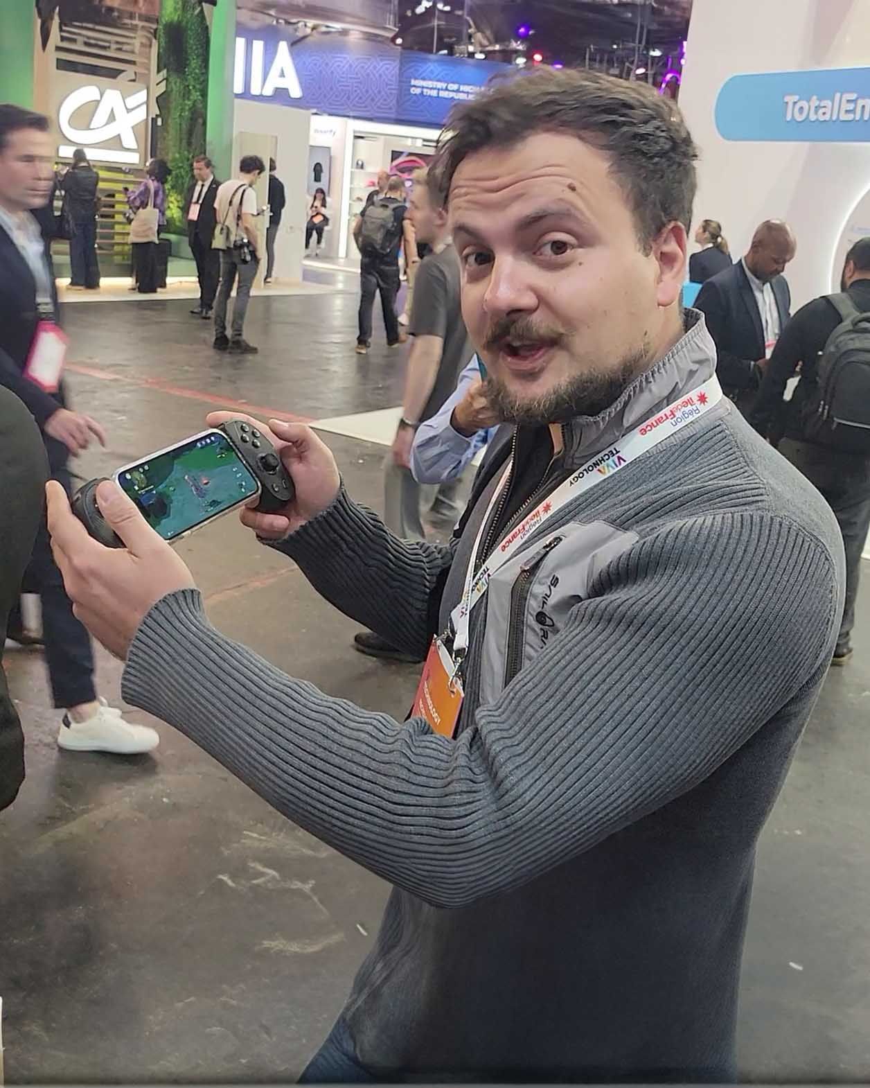 Booth visitor says the S3 Controller is very responsive while playing Genshin Impact at VivaTech 2024