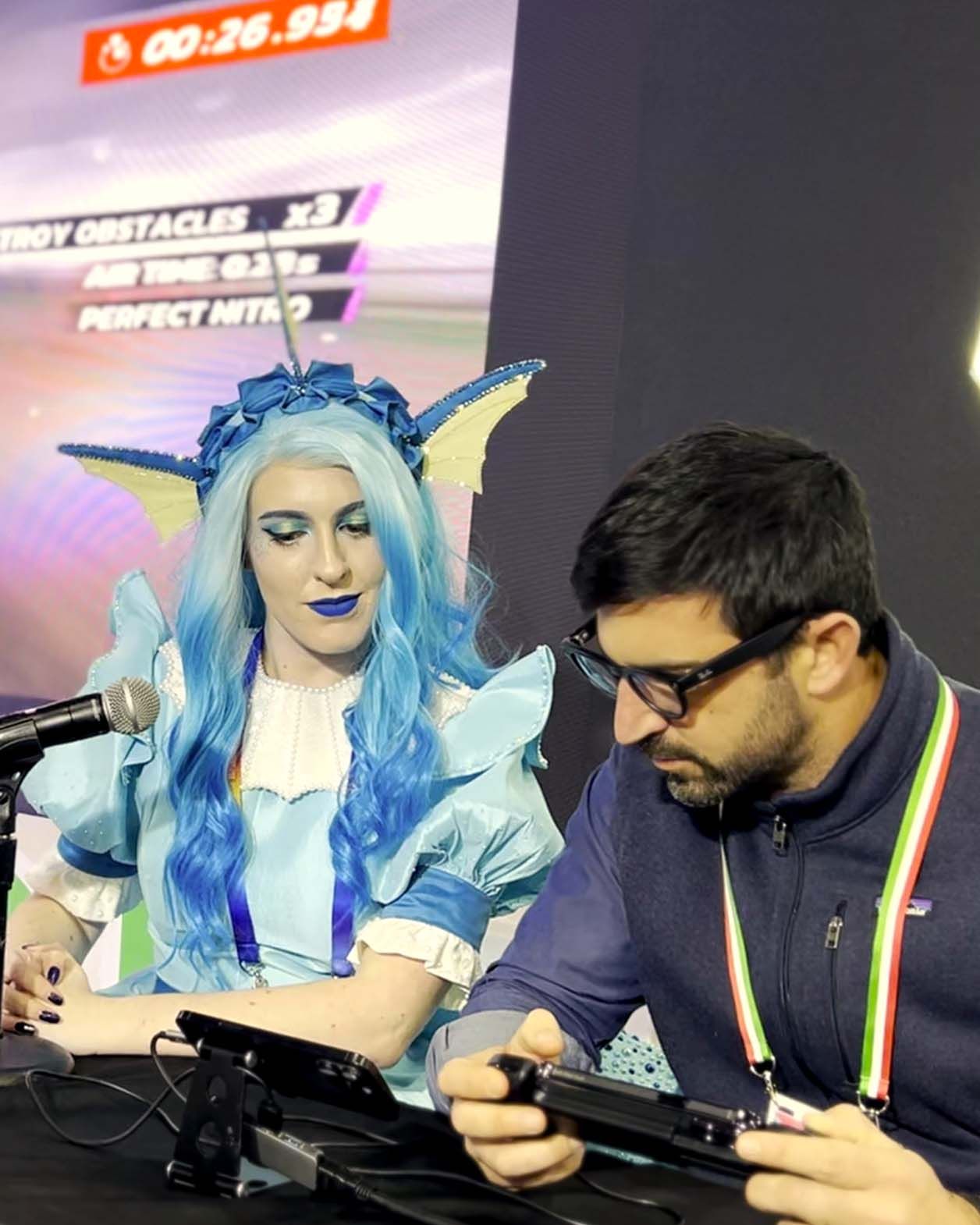 The male concentrates on his race in Asphalt 9 with the S3 Game Controller