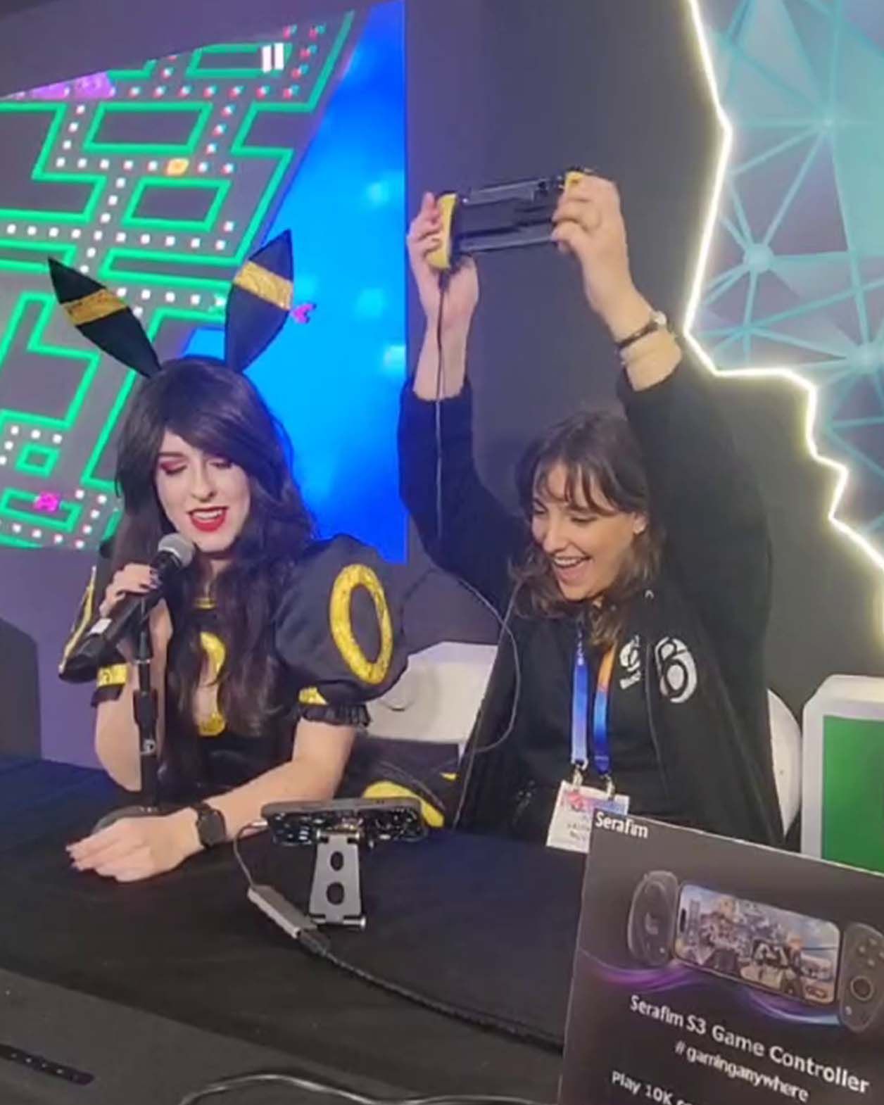 A female player feels pleased while playing Pac-Man with the Serafim S3 Game Controller