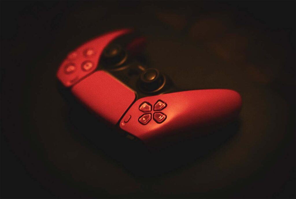The red PS5 DualSense wireless controller in red color